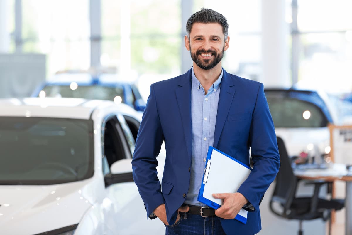 stock-photo-car-dealer-in-showroom-661973974